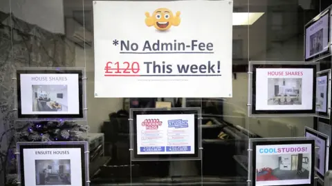 Getty Images A letting agents window advertises a 'No Admin Fee' promotion