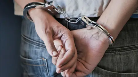 Getty Images man in handcuffs