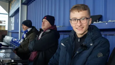 Jamie Niblock/BBC Jack in the press box at Billericay Town