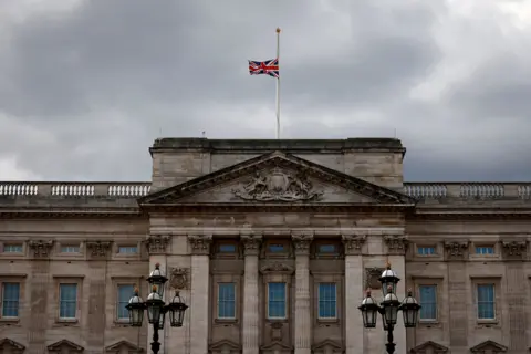 AFP The union flag flies at half-mast atop Buckingham Palace