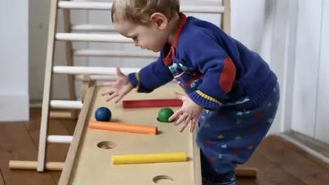 @themummyhomestead Child playing with wooden toys