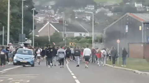 Twitter | Kidwelly & Burry Port Police A large crowd gathered on Wednesday