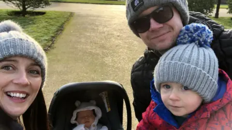 Family Photo Katherine Moore with her husband Andrew and children, George and grace
