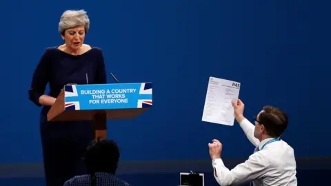 Reuters Theresa May and Simon Brodkin