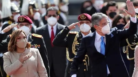 EPA Ecuador;s President-elect Guillermo Lasso (R), accompanied by his wife Maria De Lourdes Alcivar (L), arrives for his inauguration ceremony at the headquarters of the National Assembly in Quito, Ecuador, 24 May 2021.