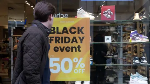 Getty Images Man outside shop