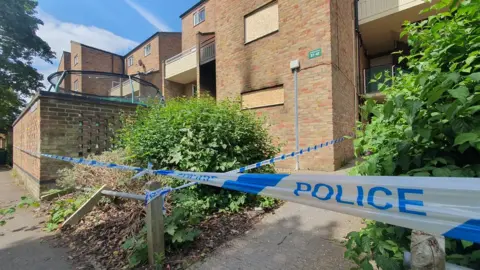 Dawid Wojtowicz/BBC Police tape in King's Hedges, Cambridge