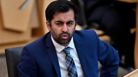 PA Media Humza Yousaf when he served as health secretary in 2021