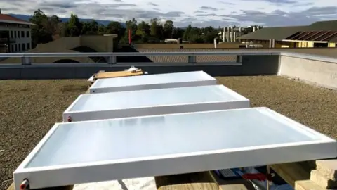 Aaswath Raman Skycool Systems' fluid cooling panels being tested on a roof