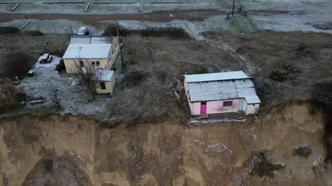 Homes on edge of dunes in Hemsby, Norfolk