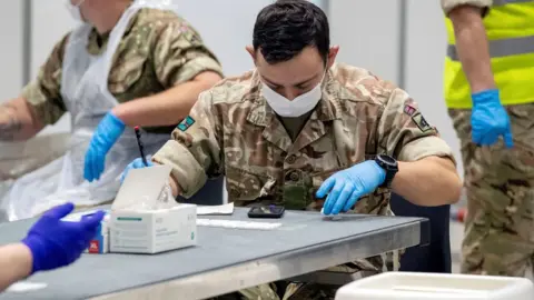 Reuters FILE PHOTO: Soldiers work at The Exhibition Centre, which has been set up as a testing centre as part of the mass coronavirus disease