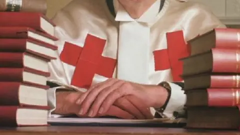 PA Media Judge with legal books