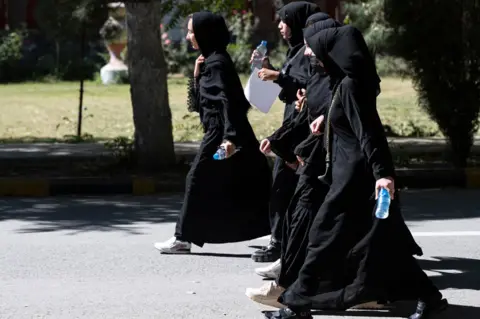 AFP Afghan female students arrive for entrance exams at Kabul University in Kabul on October 13, 2022