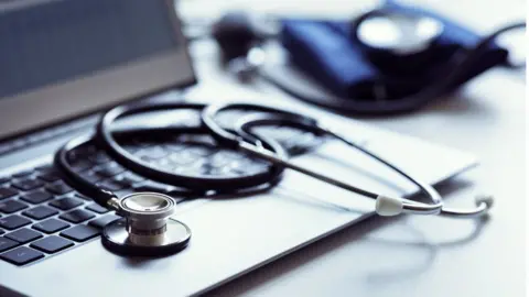 Getty Images Doctor's laptop and stethoscope