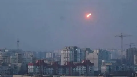 Missile explodes in the sky over Kyiv