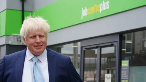 PA Media A wax figure of Boris Johnson outside a jobcentre