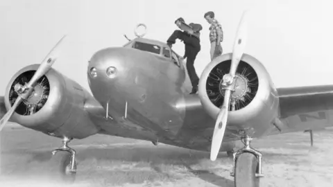 Getty Images Amelia Earhart and Fred Noonan on their Lockheed plane