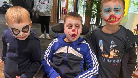 Adam Craven Jack (centre) with his brothers