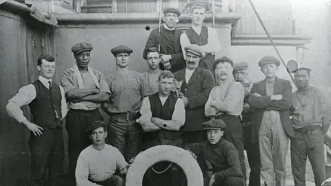 Heritage and Cultural Exchange Steam ship crew in Cardiff Docks