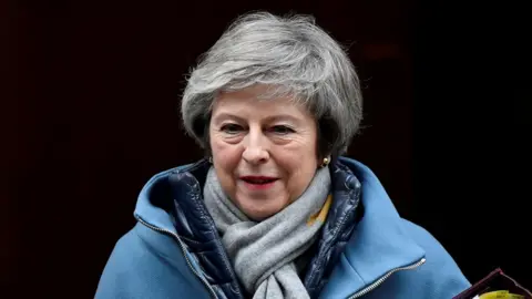 Reuters Theresa May heads to the Commons for Prime Minister's Questions