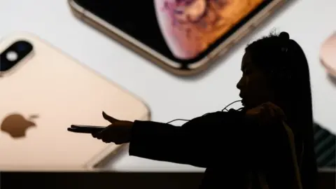 AFP Apple customer in front of store