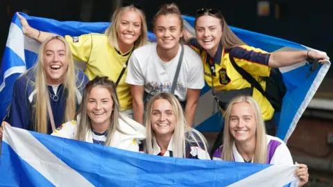 PA Media fans at Edinburgh Waverley station on Friday