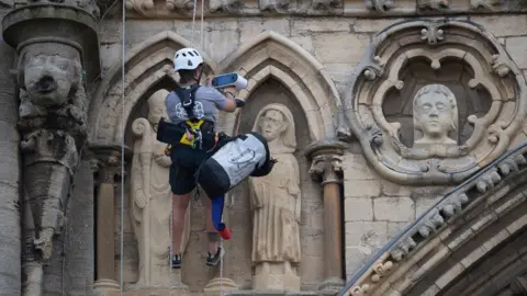 PA Media Conservationists abseil Peterborough Cathedral with scanners