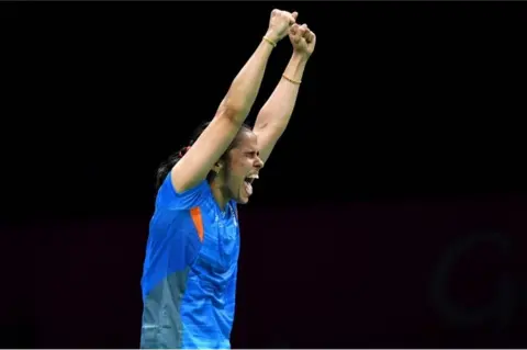 AFP India"s Saina Nehwal celebrates her victory over her India"s Venkata Pusarla in their badminton women"s single final match at the 2018 Gold Coast Commonwealth Games in Gold Coast on April 15, 2018.