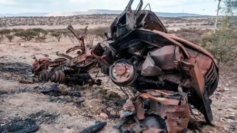 AFP A damaged military vehicle lies on the side of the road north of Mekele, the capital of Tigray on February 26, 2021.