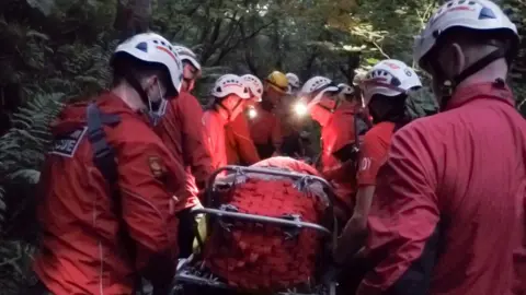 Cleveland Mountain Rescue Team Rescuers carrying the casualty