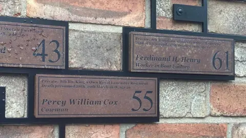 Katy Lewis/BBC Section of Last Post by artist Renato Niemis on the side of 1 King's Road, St Albans