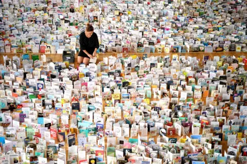 Getty Images A view of thousands of birthday cards laid out in a large hall