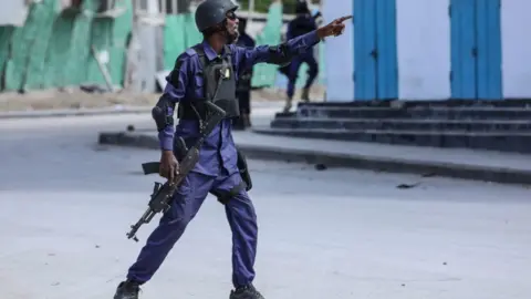 A security officer patrols the area.