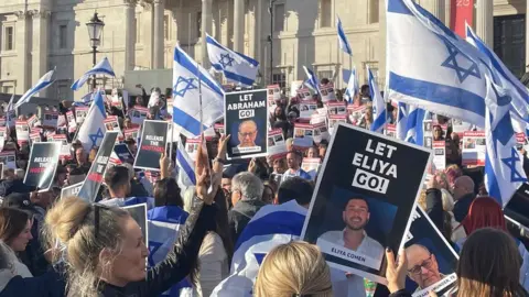 'Let Eliya go!' reads one poster