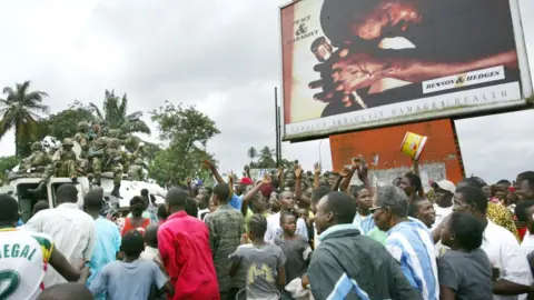 AFP Nigerian peacekeepers wade through cheering crowds of Liberians as they make their first rounds through the center of Monrovia August 7, 2003 in Monrovia, Liberia. Jubilant Liberians met the peacekeepers all along a patrol through the capital, cheering the arrival of troops to help end the Liberian civil war.