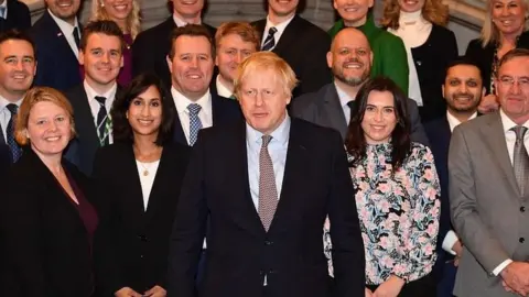 AFP Boris Johnson pictured with the 109 new Conservative MPs