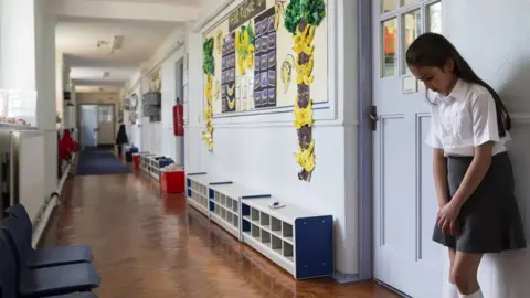 Getty Images Child outside classroom