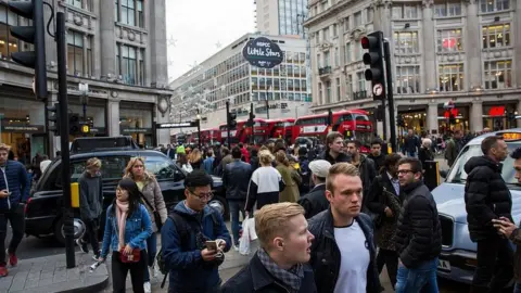 Getty Images Pedestrians in the London