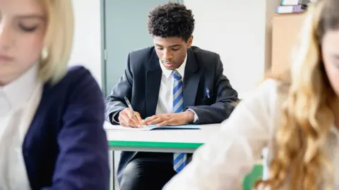 Getty Images A student taking an exam