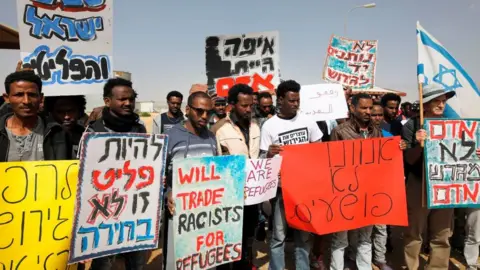 Getty Images African migrants protest against the treatment of asylum seekers by Israel