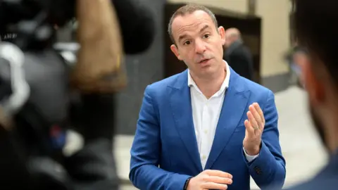 PA Media Money Saving Expert's Martin Lewis speaks to the media after a joint press conference with Facebook at the Facebook headquarters in London.