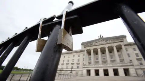AFP/Getty Images Padlocks on gate at Stormont
