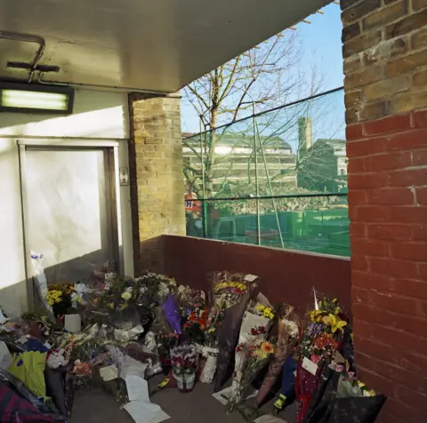 Getty Images A memorial been placed where murdered school boy Damilola Taylor died at Hordle Promenade, North Peckham Estate, London