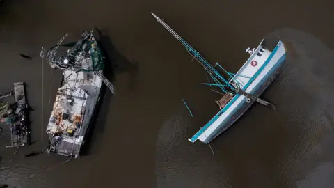 Reuters Capsized boat on the Bayou Lafourche in Galliano