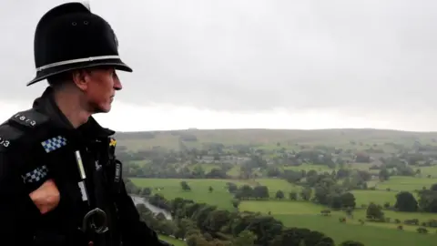 BBC PC David Williamson looks out across fields