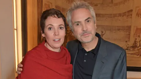 Getty Images Olivia Colman and Alfonso Cuaron