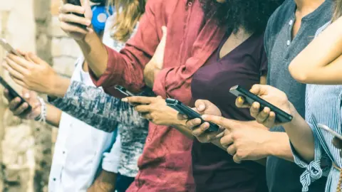 Getty Images People on phones