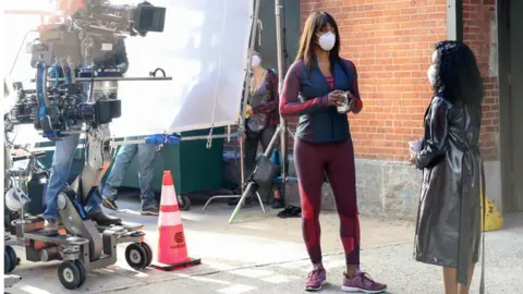 Getty Images Laverne Cox on set as Anna's personal trainer, Kacy Duke, in the Netflix production Inventing Anna