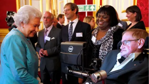 Reuters Britain"s Queen Elizabeth (L) meets Stephen Hawking during a reception for Leonard Cheshire Disability charity at St James"s Palace in London May 29, 2014.