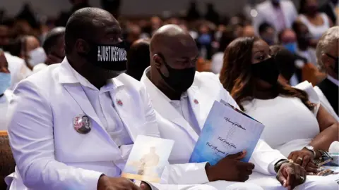 Getty Images Image shows Rodney Floyd (L) and Philonise Floyd (C) brothers of George Floyd, attending their brother's funeral service